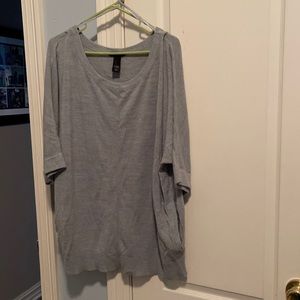 Scoop neck plus size sweater with pockets.